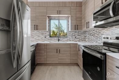 KINGSLEY TOWNHOMES 2 BED PLUS DEN UNIT 3.